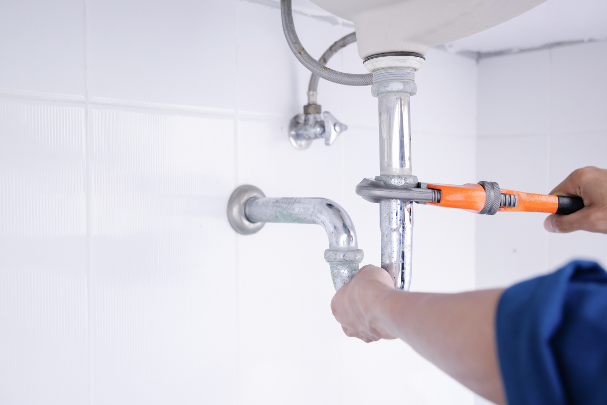 House HePlumber working in the bathroom, plumbing repair service.ating Valves House HePlumber working in the bathroom, plumbing repair service.ating Valves